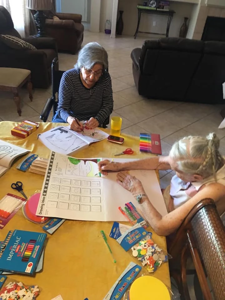 Resident enjoying a craft activity