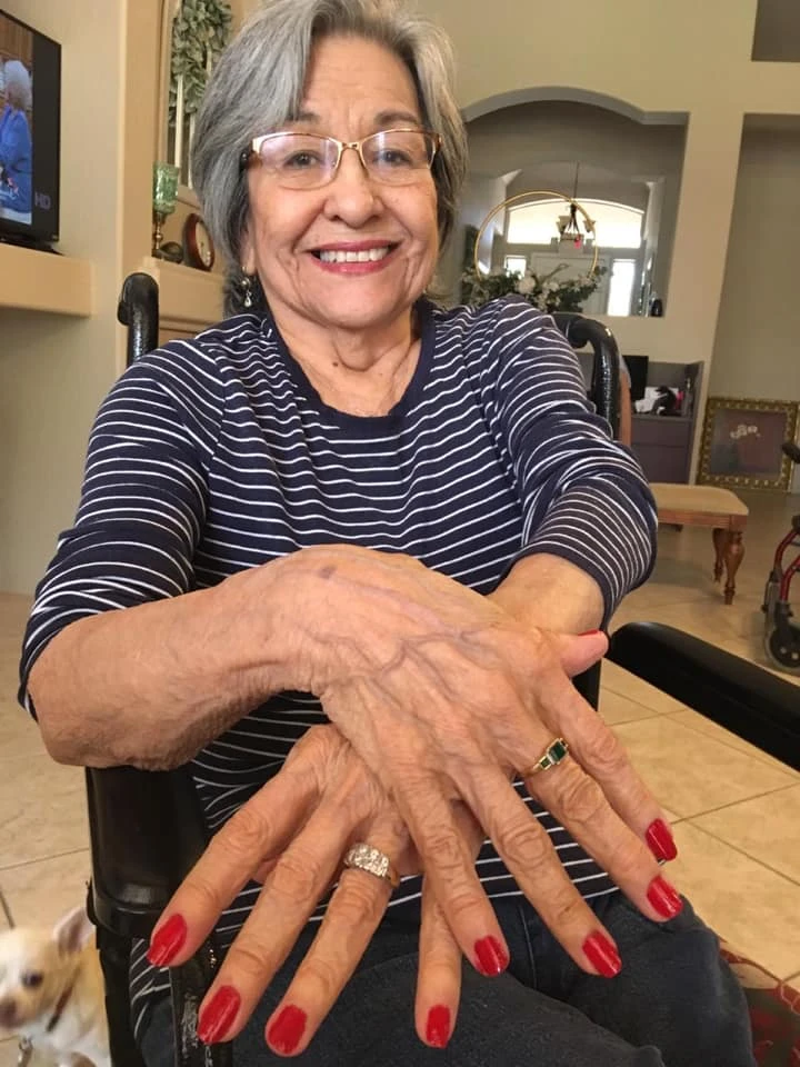 A resident receiving a manicure